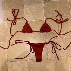 Kulani kini set in rubbed clay. Small bottoms and XS top. NWT